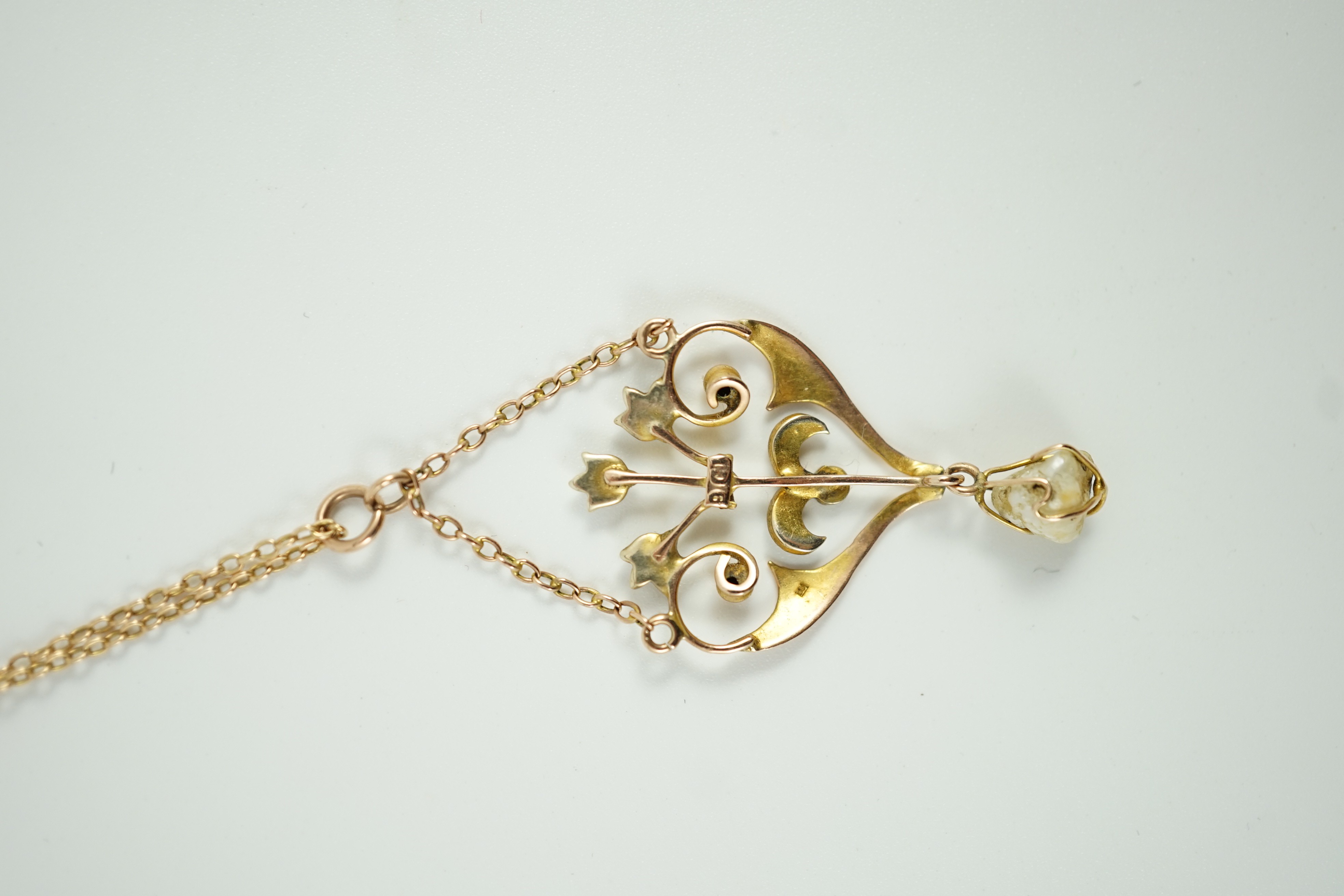 An Edwardian 9ct, baroque and seed pearl set drop pendant necklace, 47cm, gross weight 4.3 grams.